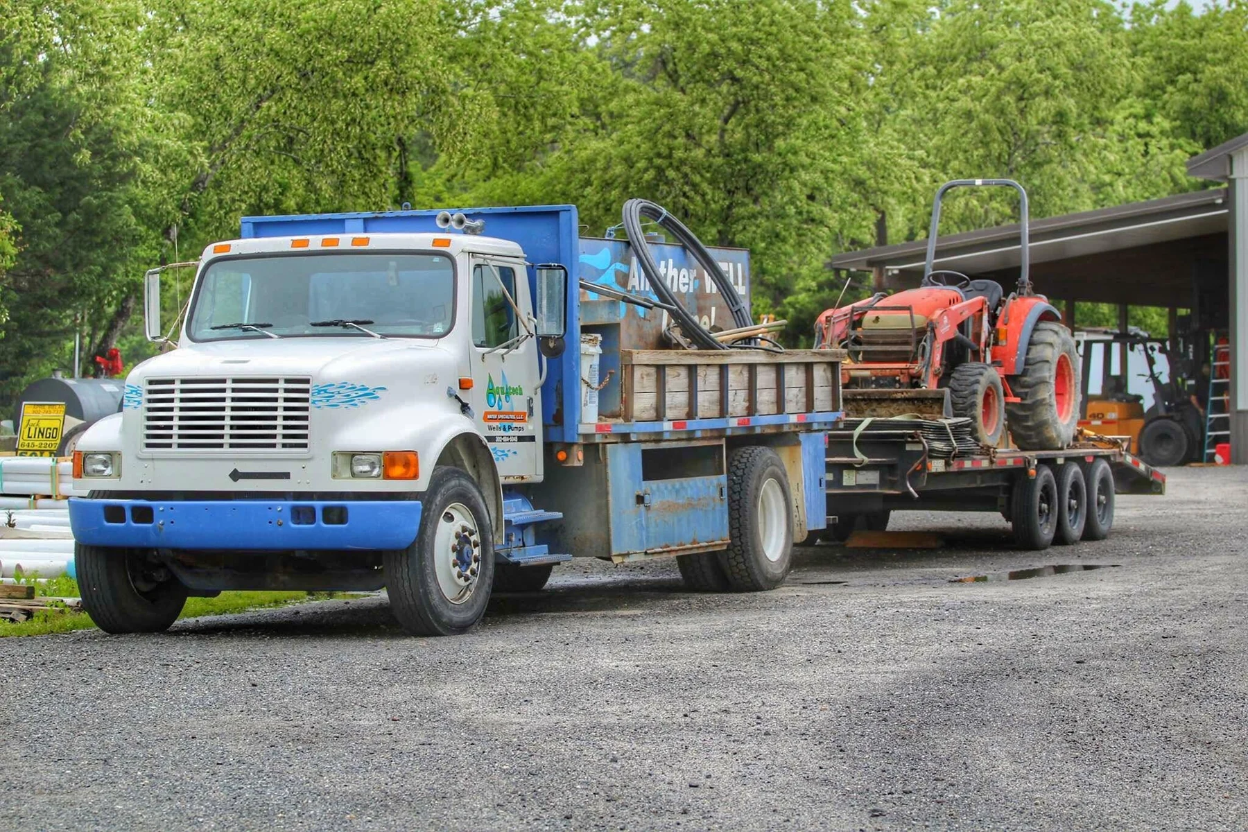 Aquatech well drilling truck and equipment on a local job